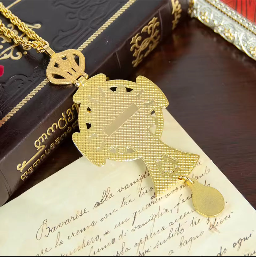 Vergulde kruisketting met blauwe edelstenen